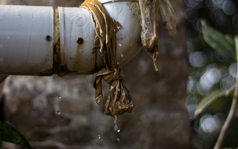 Water spraying from a leaking pipe joint